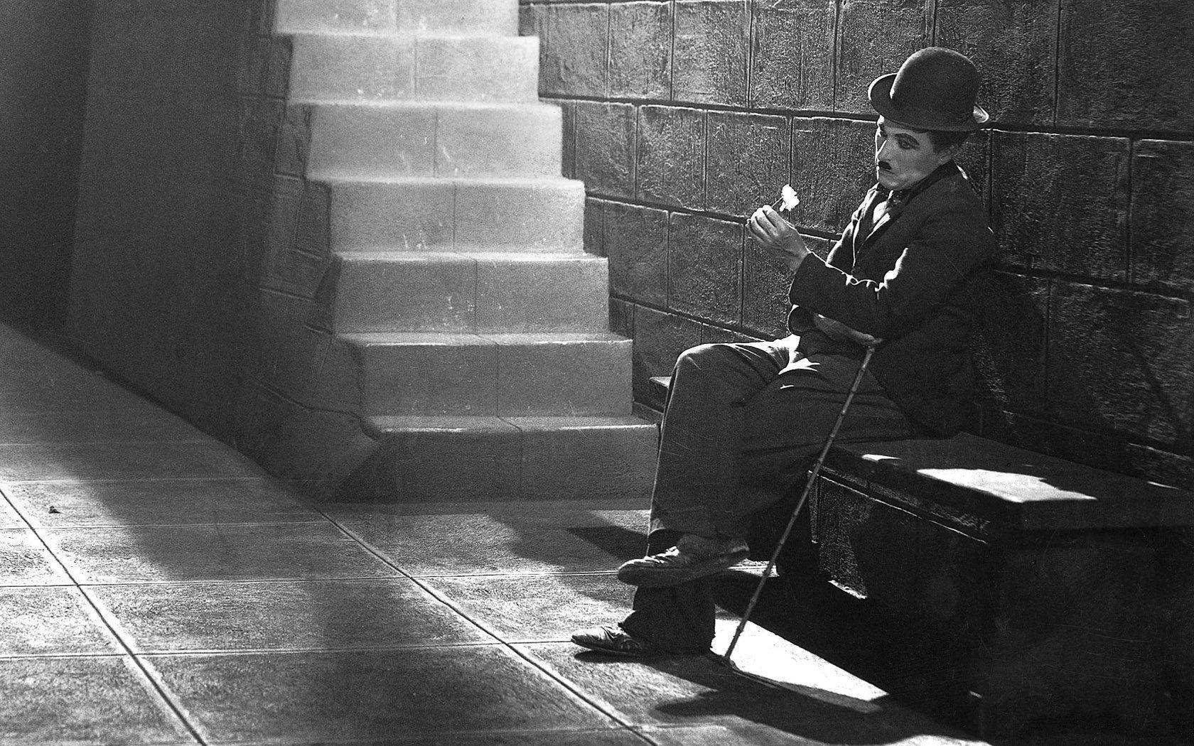 Image Charlie Chaplin In A Sad And Reflective Portrait Background