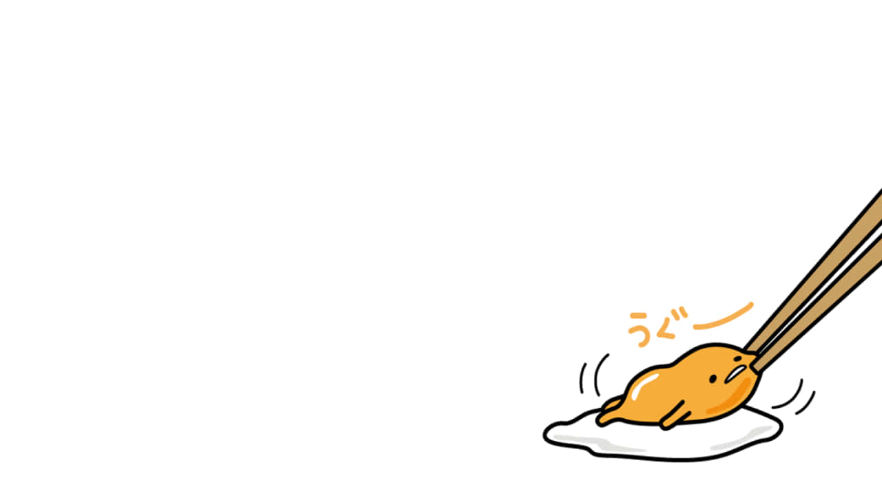 Image Gudetama Situating Itsself On A Computer Keyboard Background