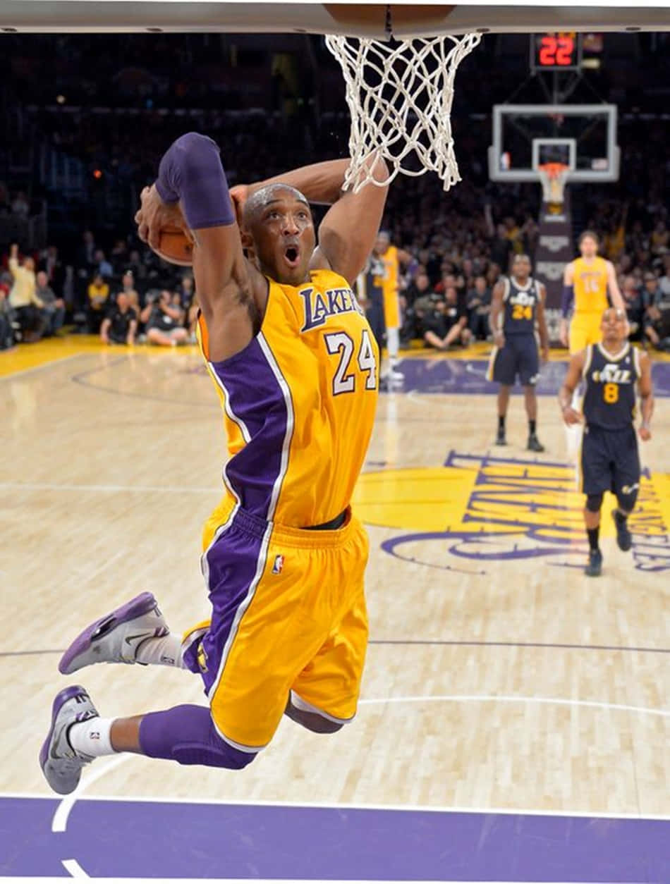 Image Kobe Bryant Slams The Ball Through The Hoop Background