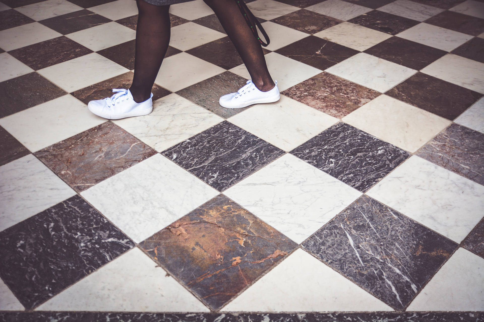 Imaginative Perspective Of A Person Standing On A Checkered Floor