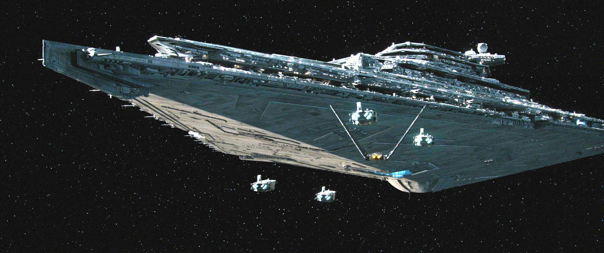 Imperial Star Destroyer From Star Wars Looms In Space Background