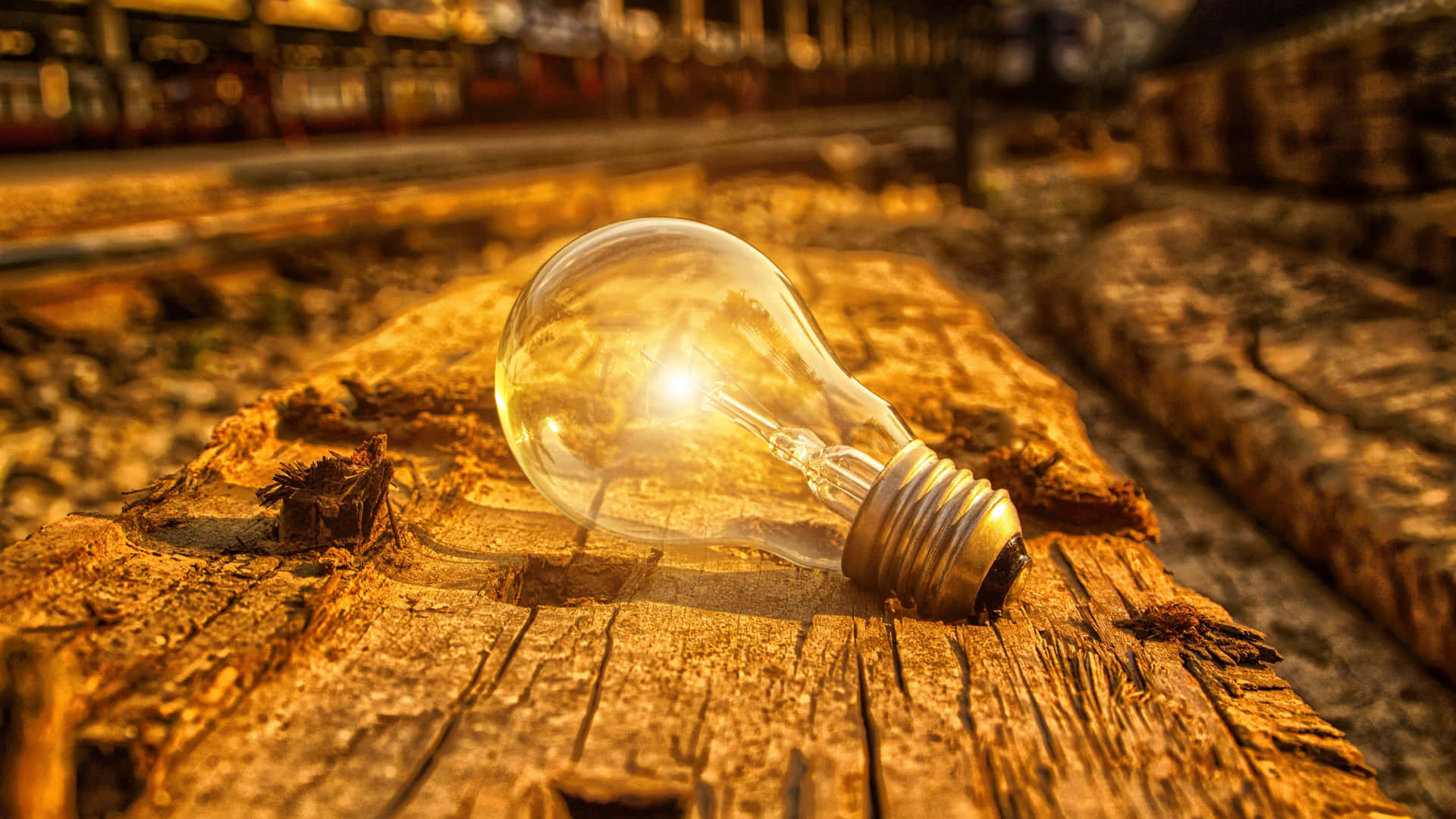 Incandescent Bulb In Tracks Background