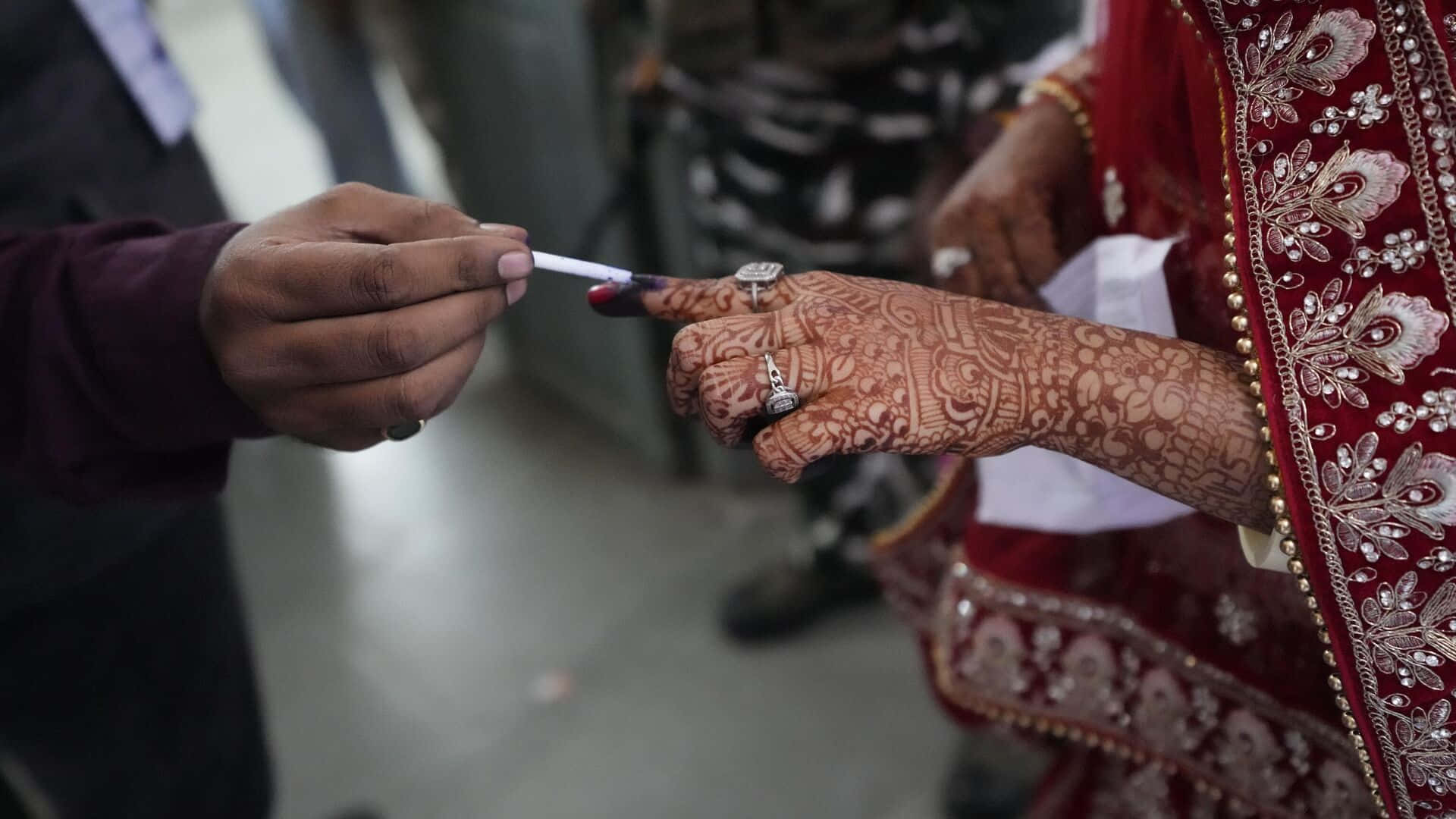 Indelible Ink On Finger With Hand Tattoo Background