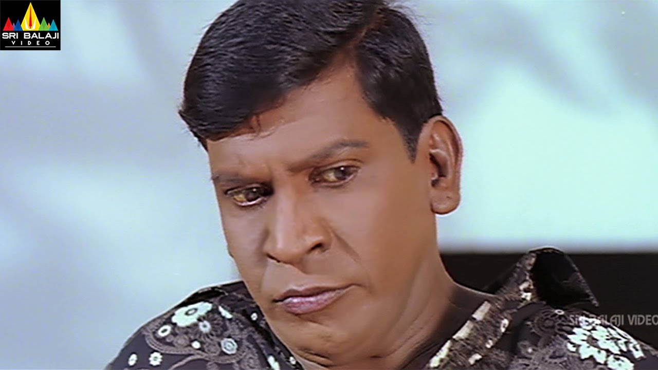 Indian Actor Vadivelu In Floral Shirt Background