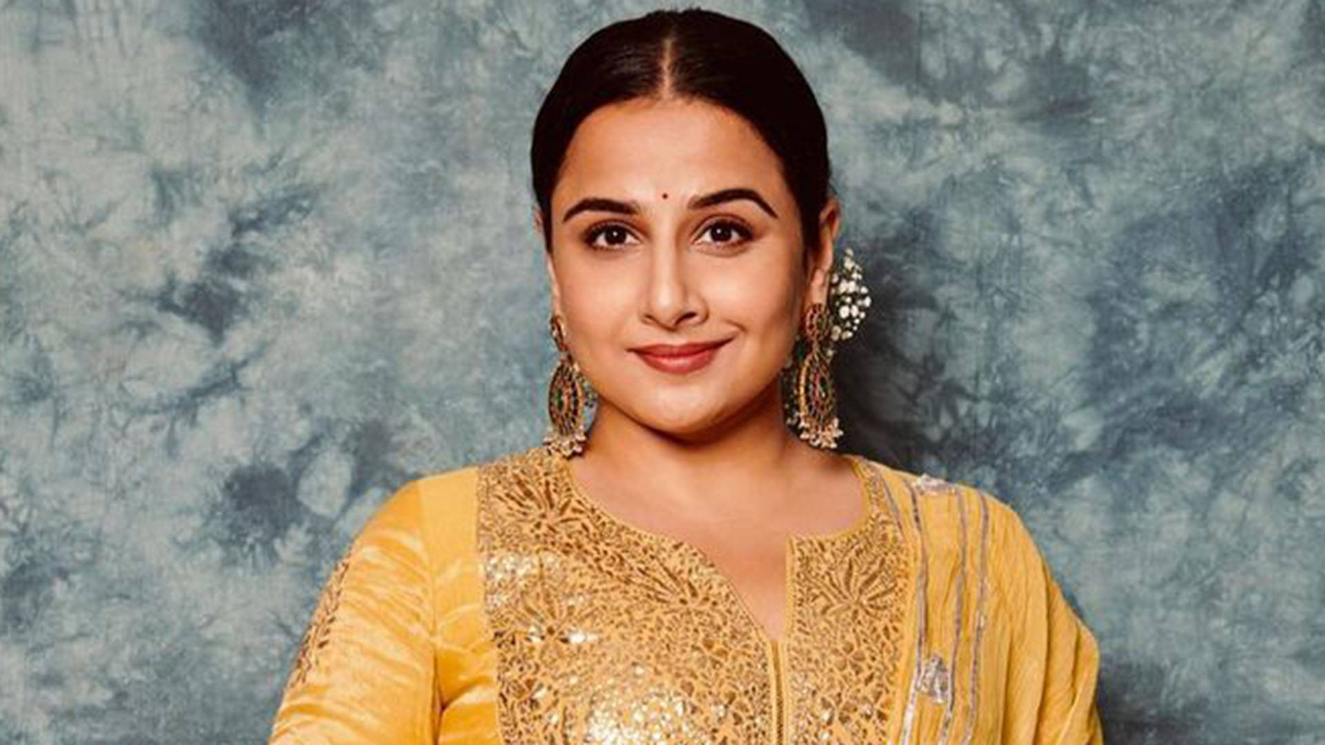Indian Actress Vidya Balan In Yellow Background