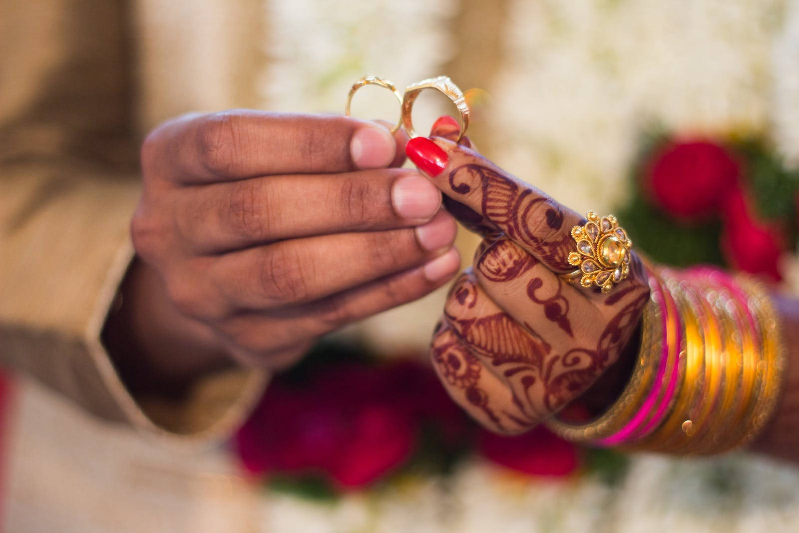 Indian Couple Enthralling Moment Of Exchanging Wedding Rings