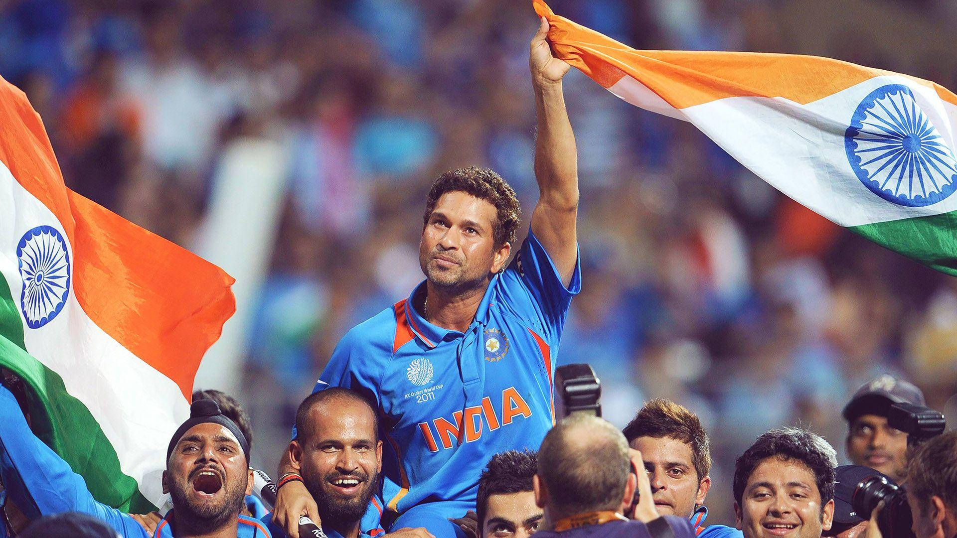 Indian Cricket Team With National Flag Background