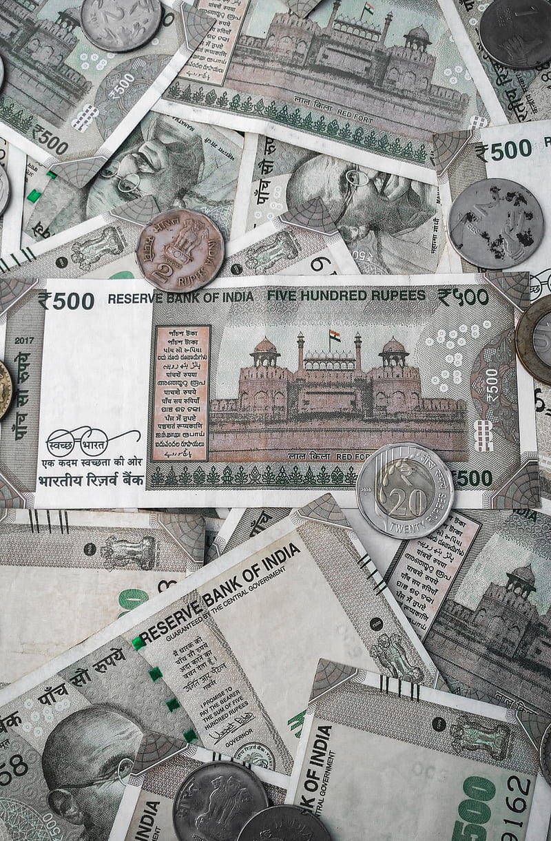 Indian Currency Banknotes And Coins Background