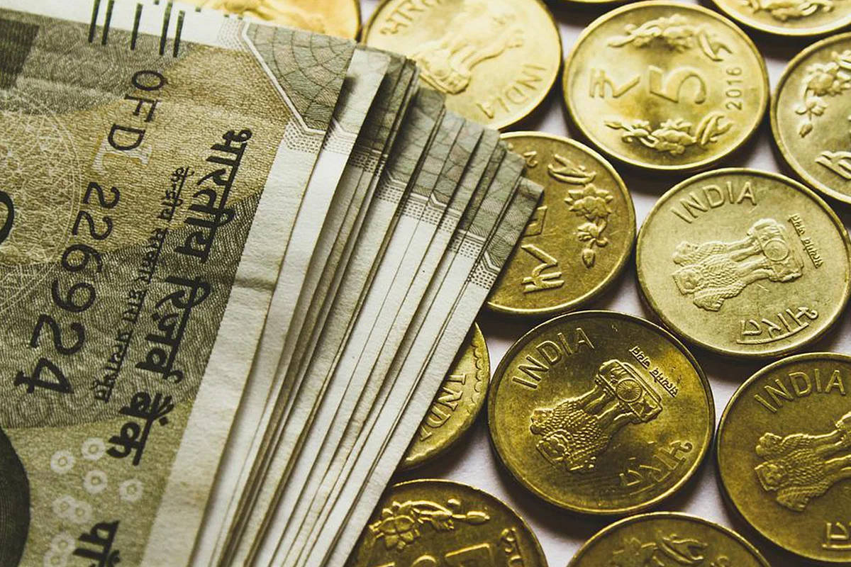 Indian Currency Gold Bills And Coins Background