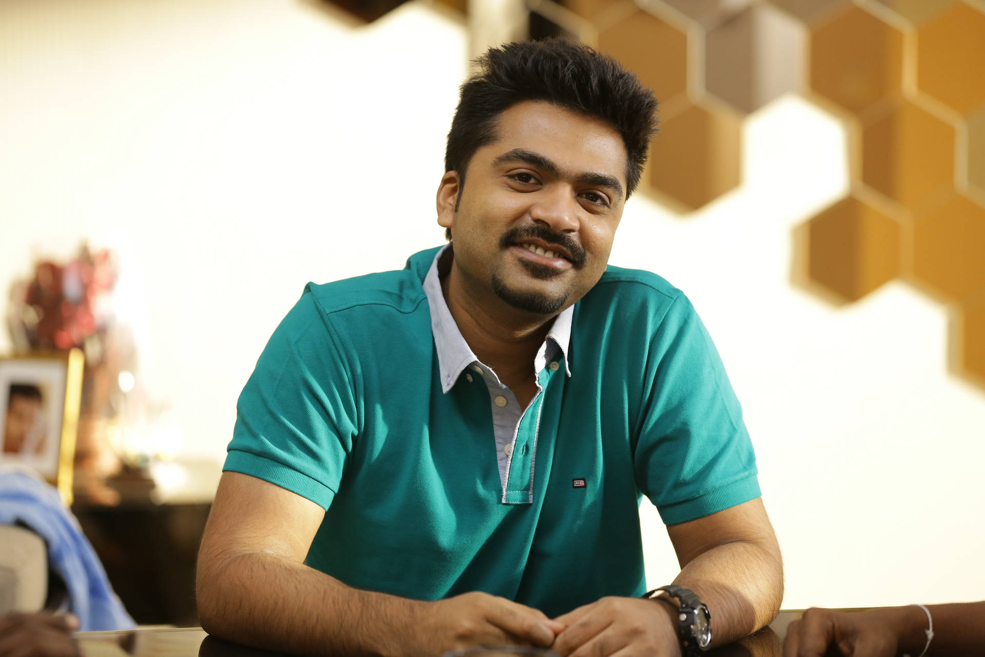 Indian Film Actor Simbu Posing With A Casual Polo Shirt. Background