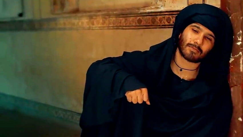 Indian Film Icon Feroz Khan In All Black Attire Background