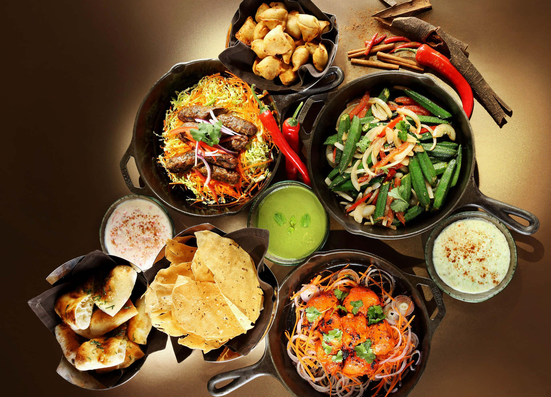 Indian Food In Black Pans Background