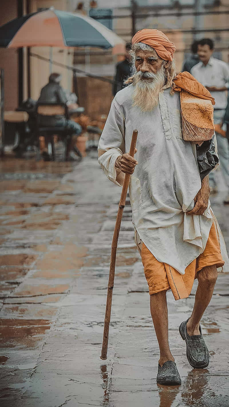Indian Man With Walking Stick Background