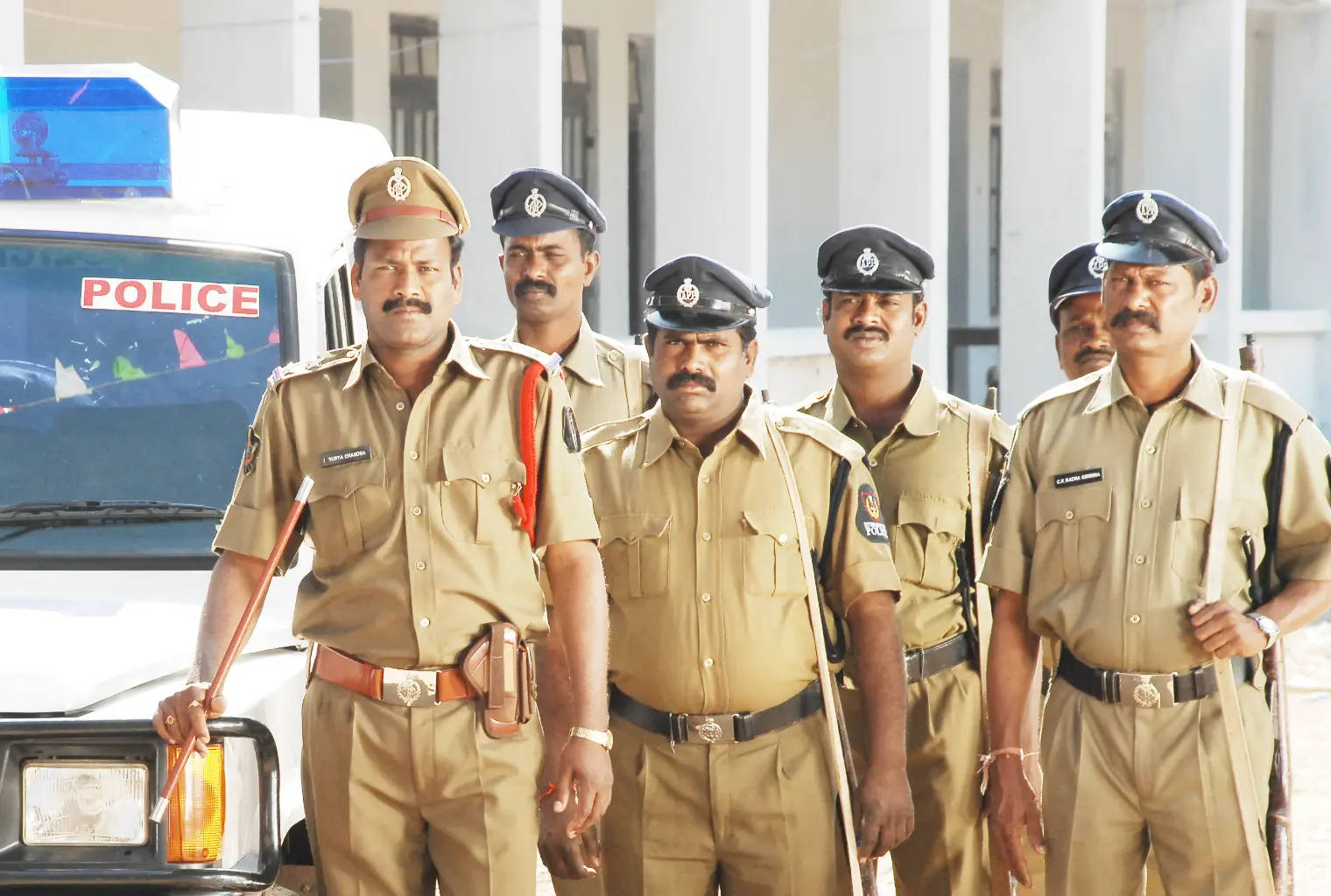 Indian Police Posing With Car Background