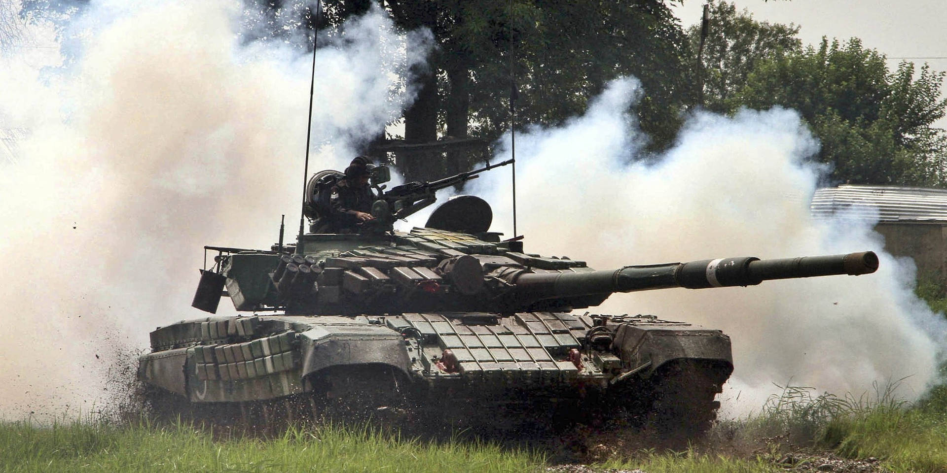 Indian Soldiers On Tank In Trials Background