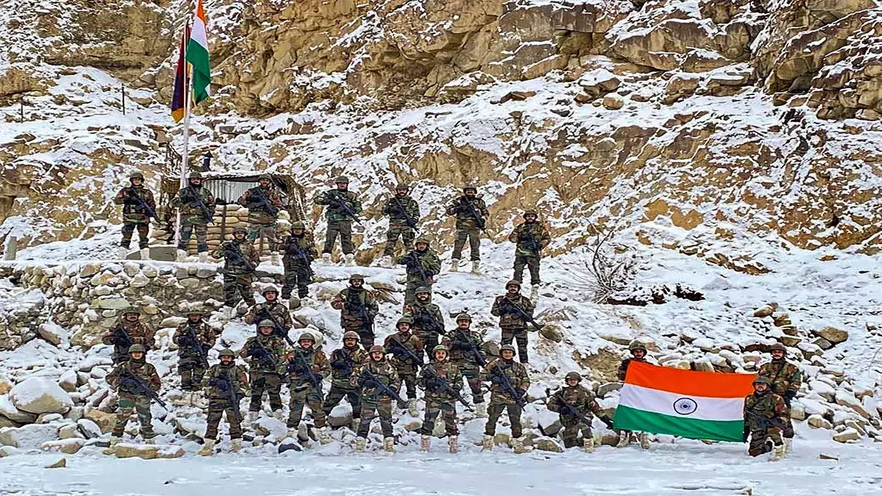 Indian Soldiers Posing With Flag