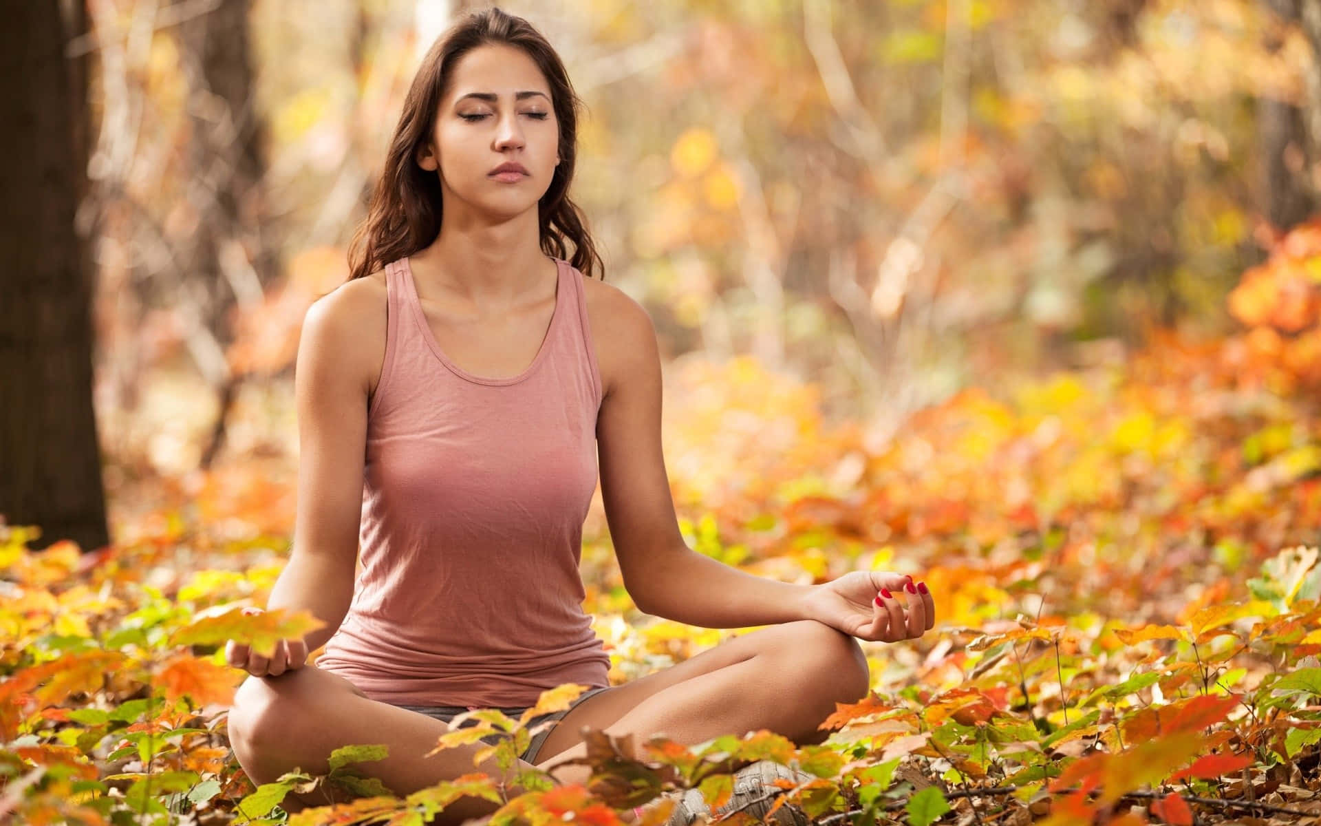 Indian Woman Doing Yoga In Autumn Landscape