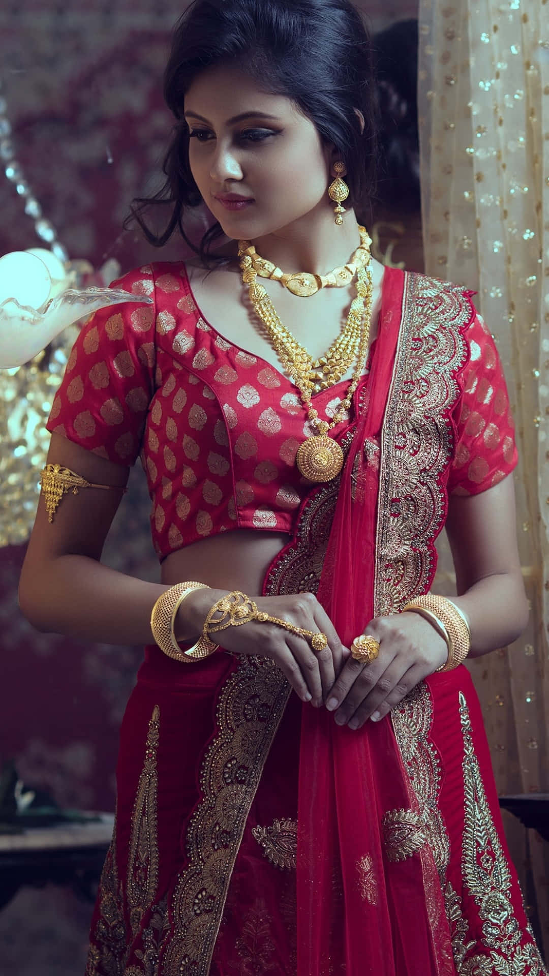 Indian Woman Wearing Red Sari And Kundan Jewelry