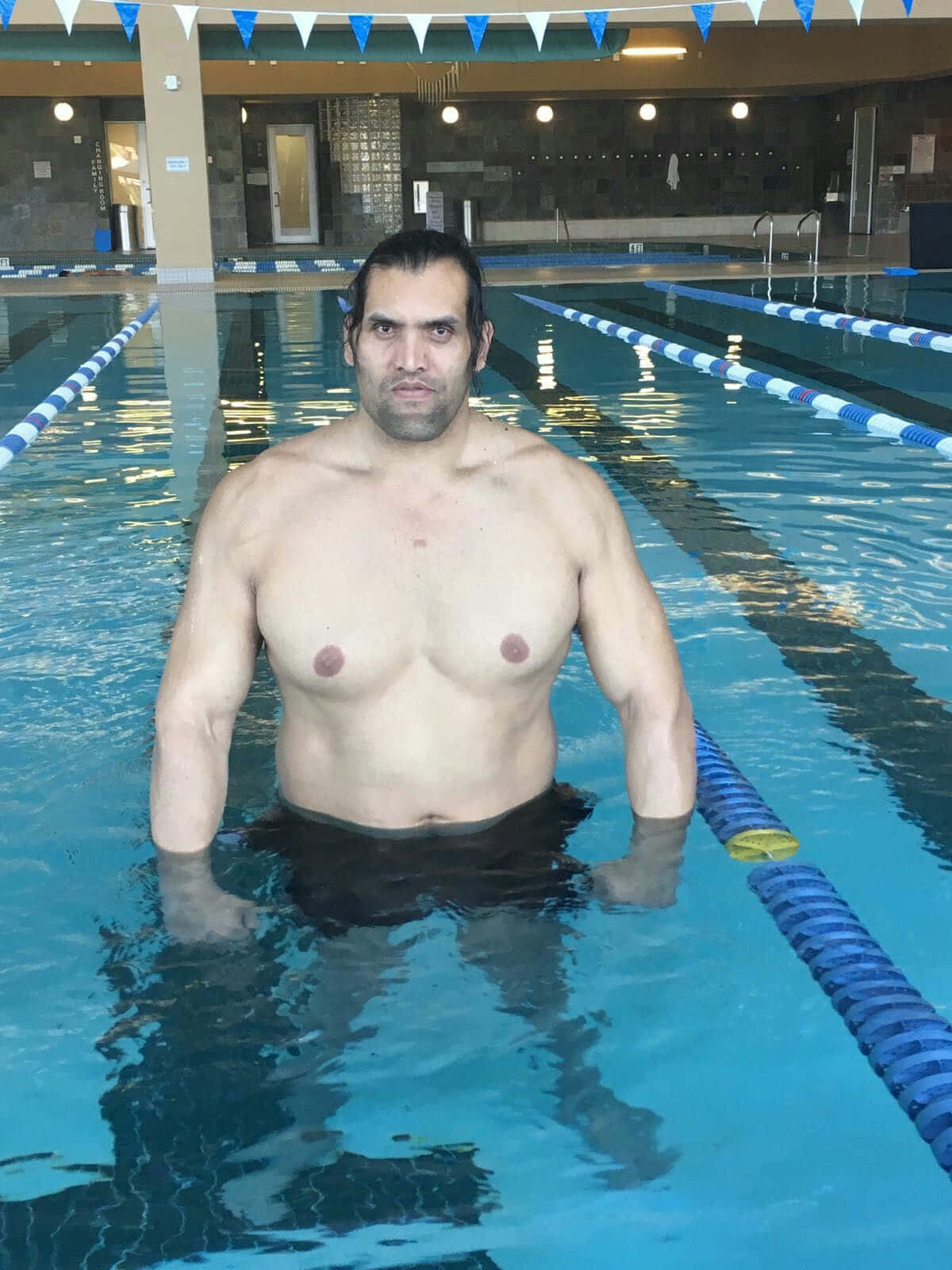 Indian Wrestler The Great Khali On A Pool Background