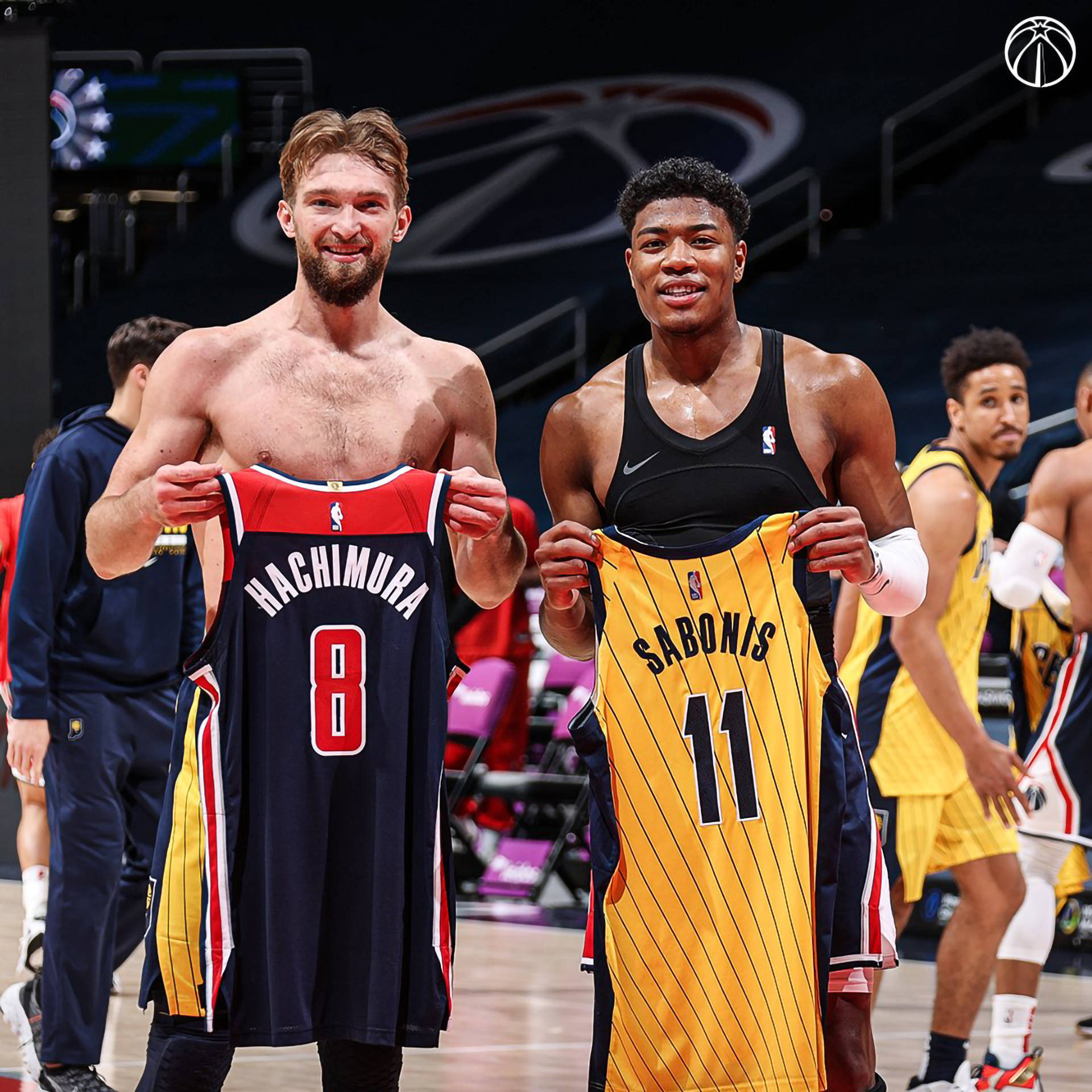Indiana Pacers Star Domantas Sabonis Exchanging Jerseys Post-game Background