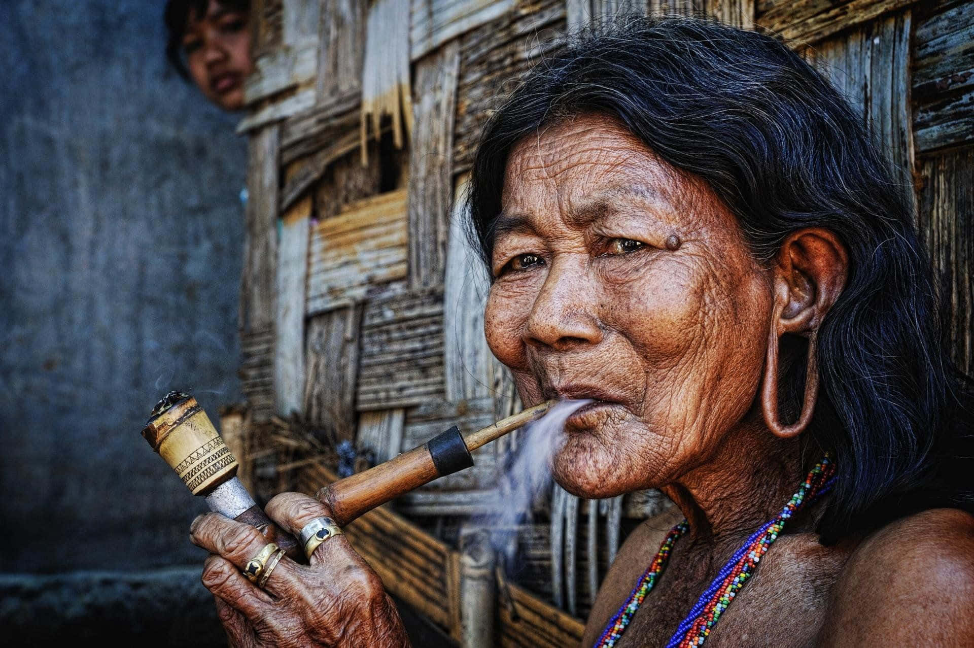 Indigenous Old Lady Smoking Background