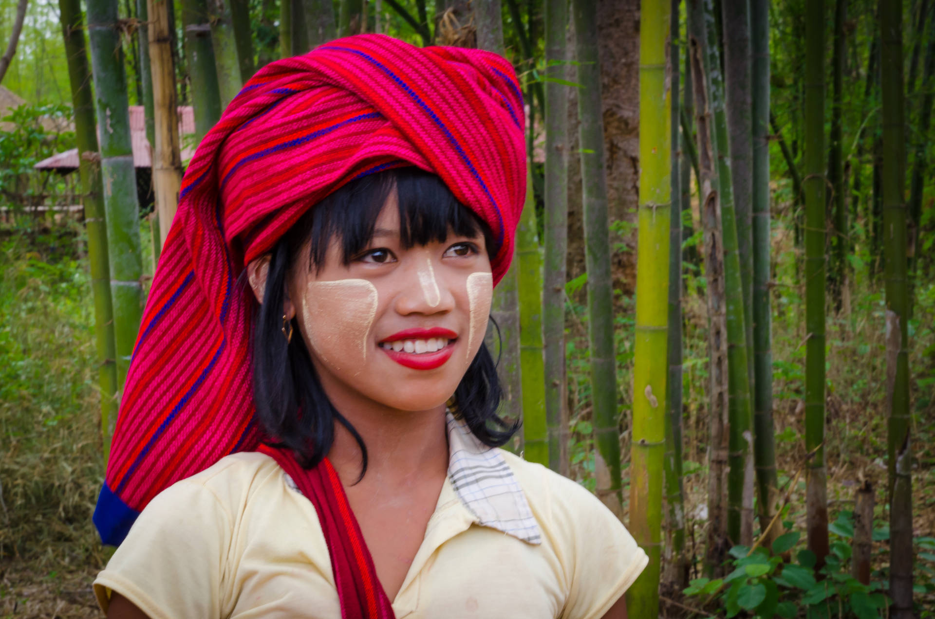 Indigenous Woman Near Bamboo Background