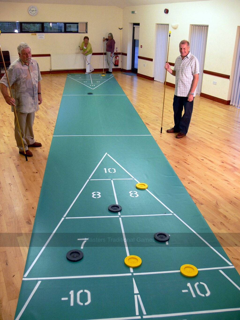 Indoor Shuffleboard Game In Action Background