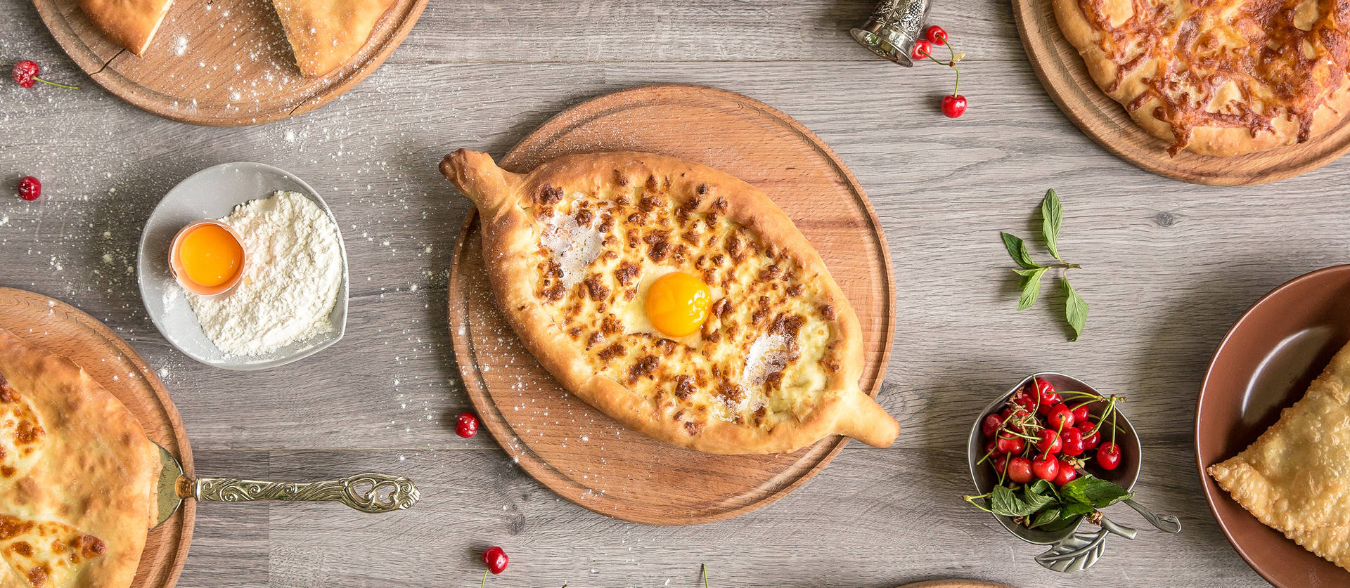 Indulge In A Piece Of Georgia With This Artistic Overhead Shot Of Khachapuri Background