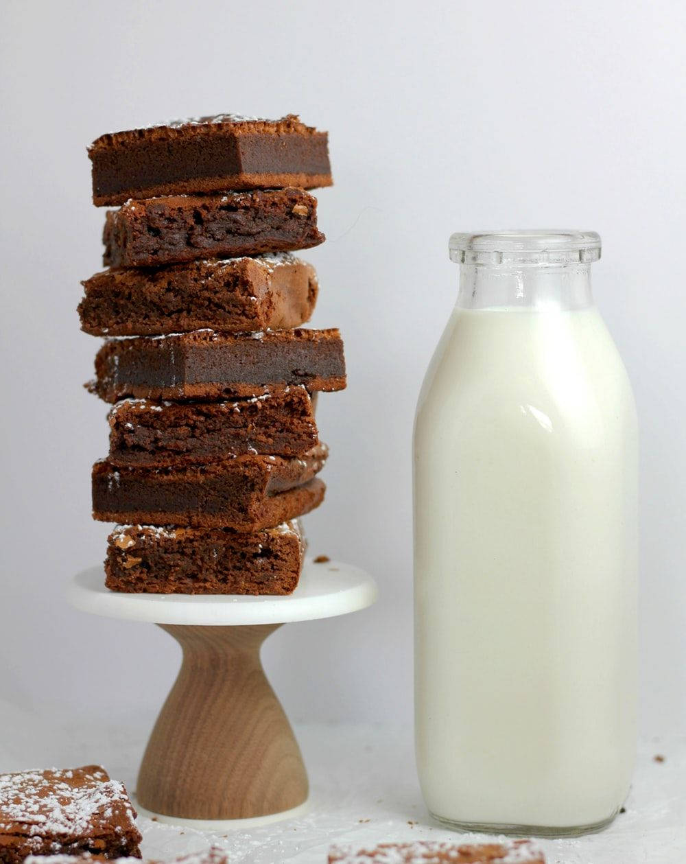 Indulgent Homemade Brownies Accompanied By Fresh Milk Background