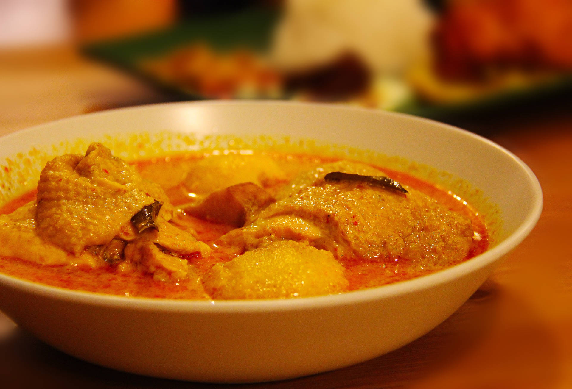 Indulgent Indian Yellow Curry Chicken Dish Background