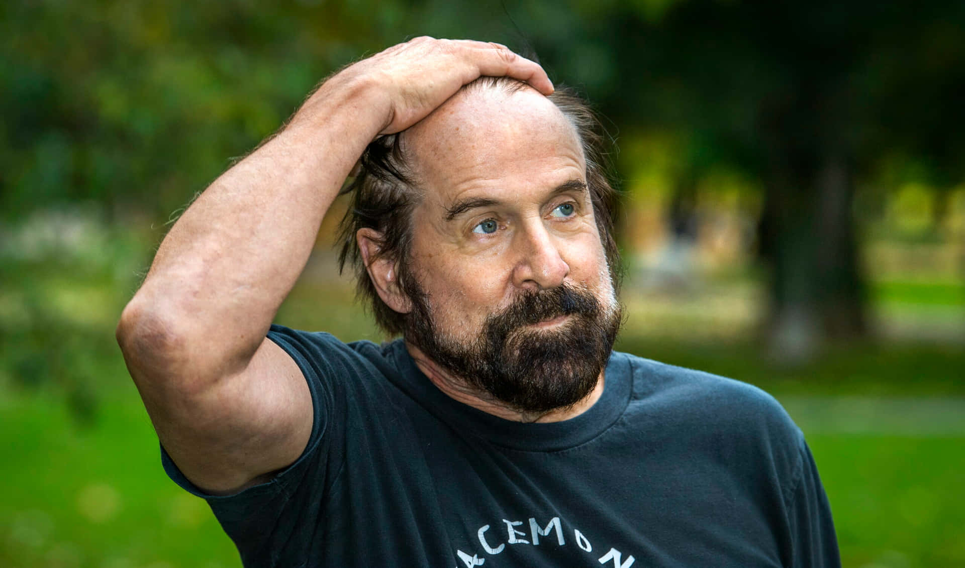 Influential Actor Peter Stormare In A Contemplative Pose Background