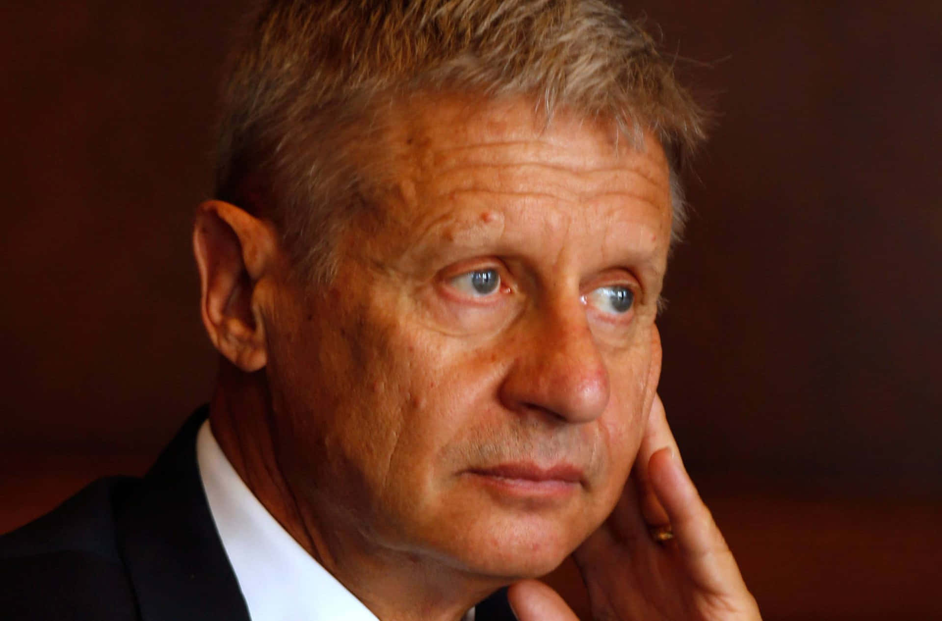 Influential Politician Gary Johnson Deep In Thought Background