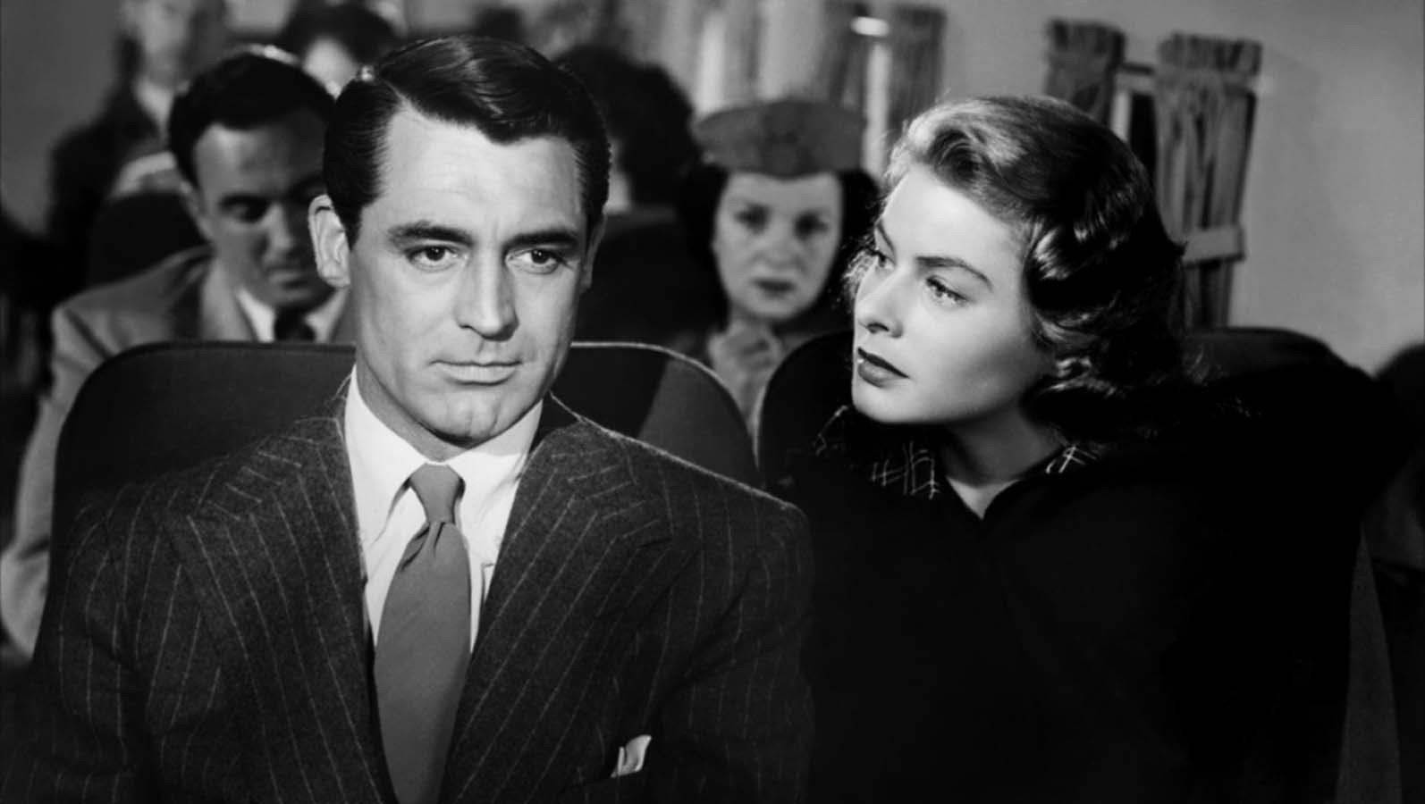Ingrid Bergman And Cary Grant In A Scene Background