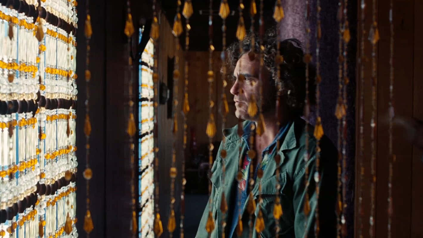 Inherent Vice Scene With Beaded Curtains Background