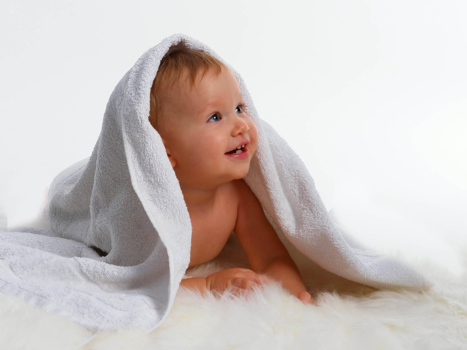 Innocent Charm - Baby Under White Fabric Background