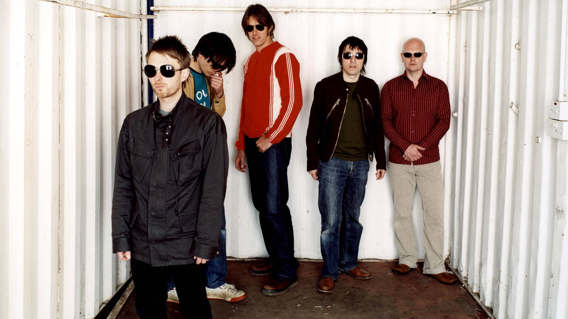 Innovative Rock Band, Radiohead In A Unique Container Surrounding Background