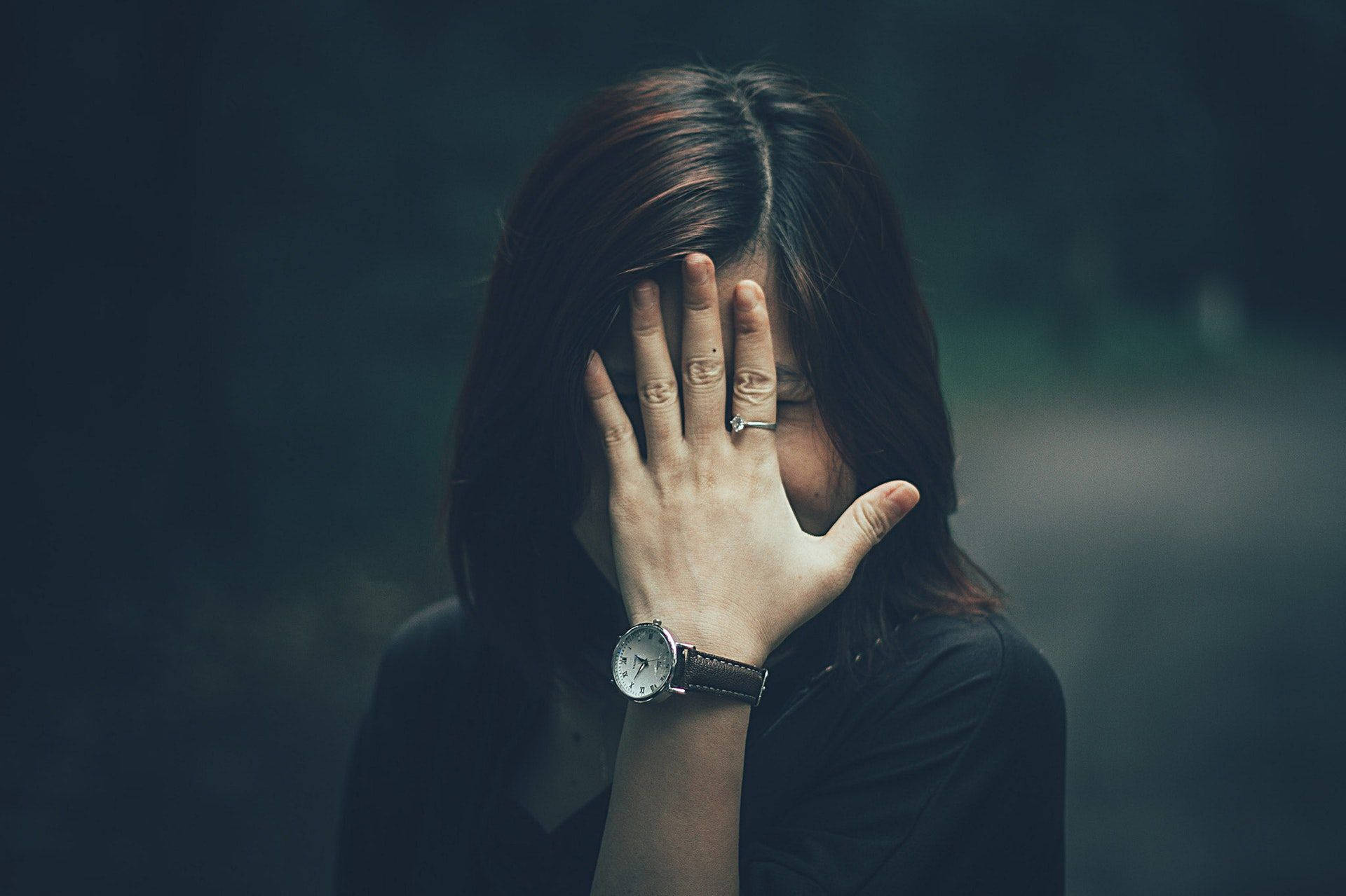 Insecure Woman Hiding Behind Hand Background