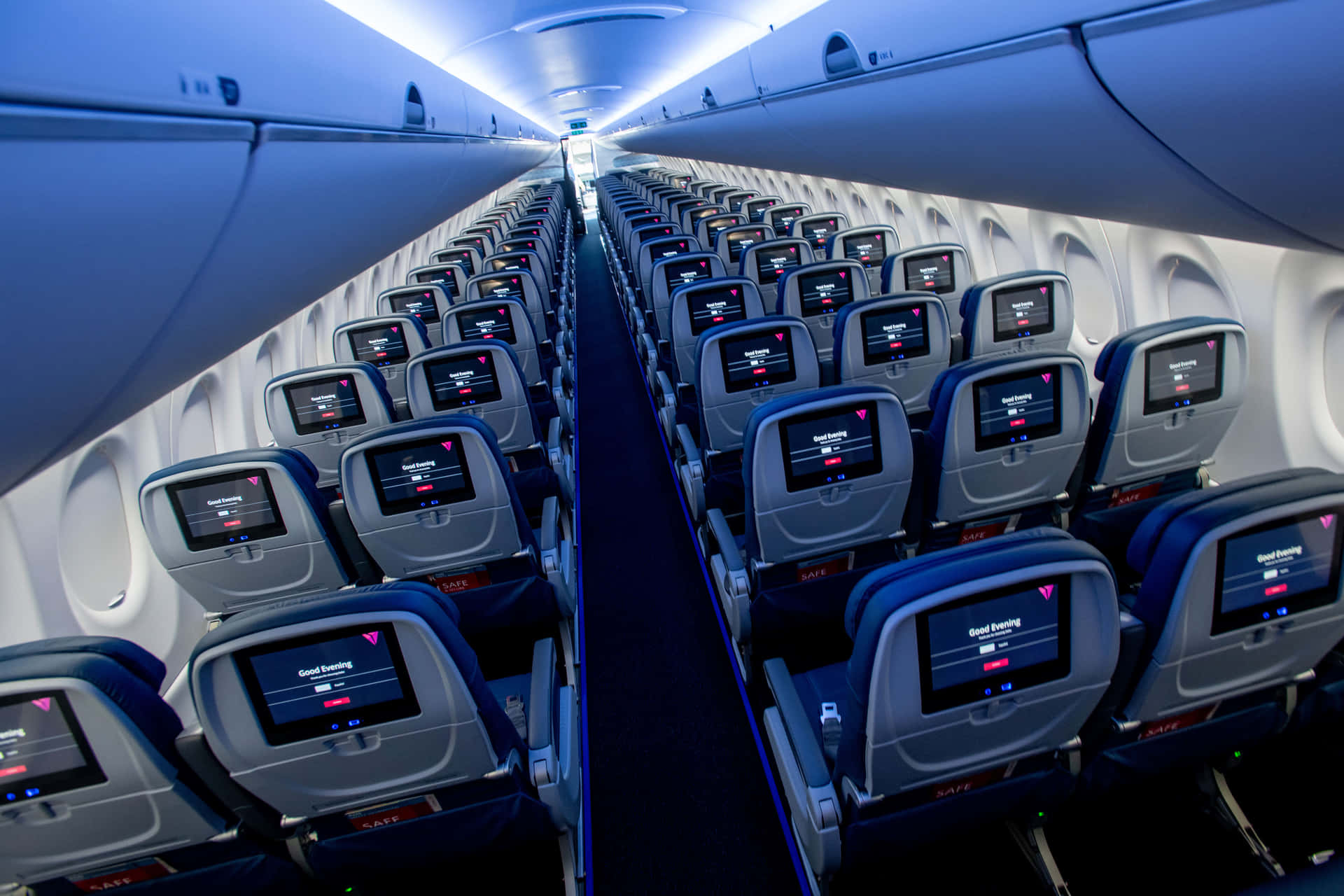 Inside An Empty Economy Class Airplane Cabin Background