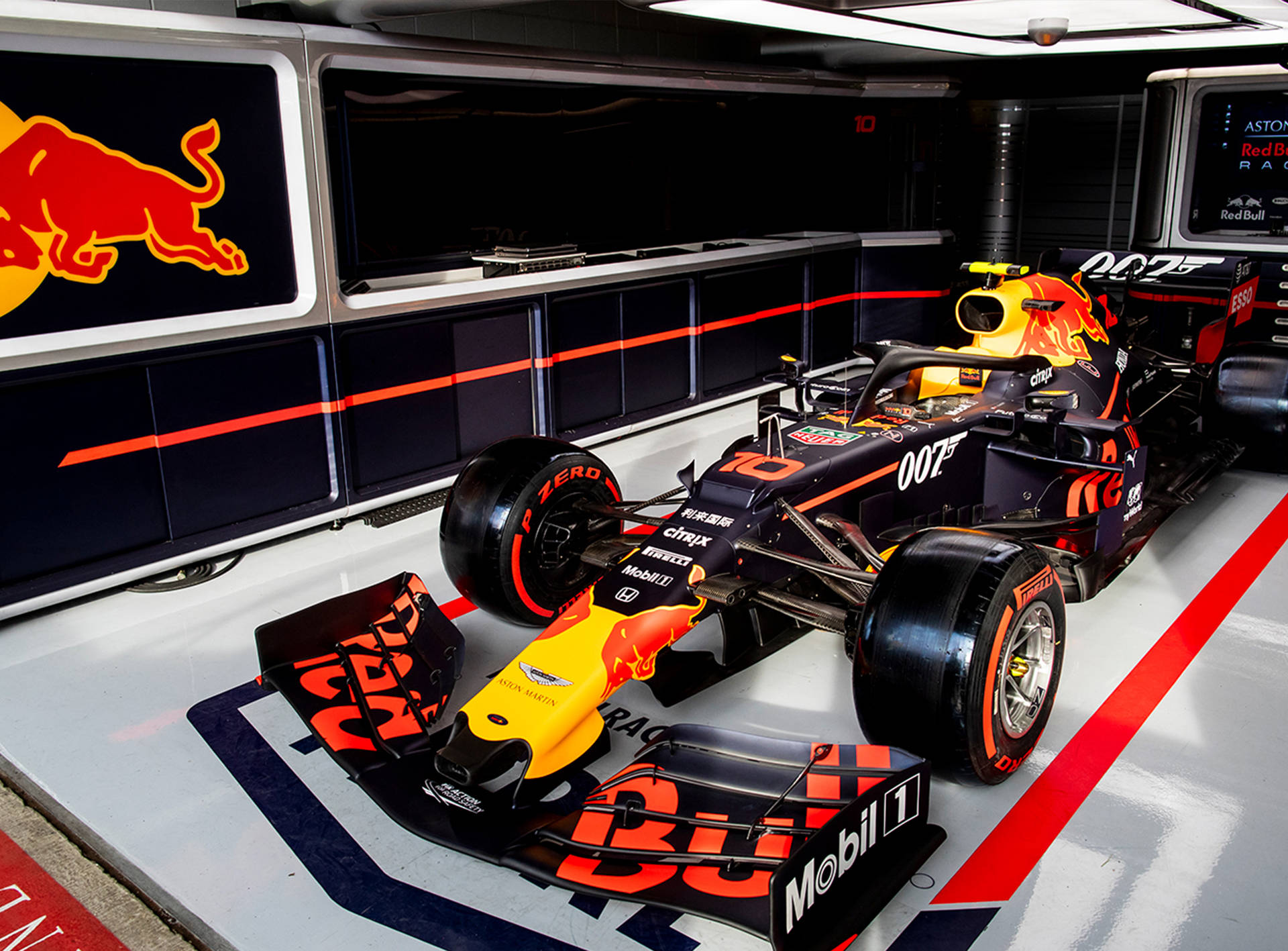 Inside The Fast-paced Operations Of Red Bull Racing Garage Background