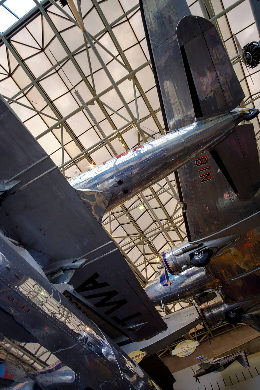 Inside The Magnificent Smithsonian Hangar Showcasing Intriguing Aircraft Displays Background