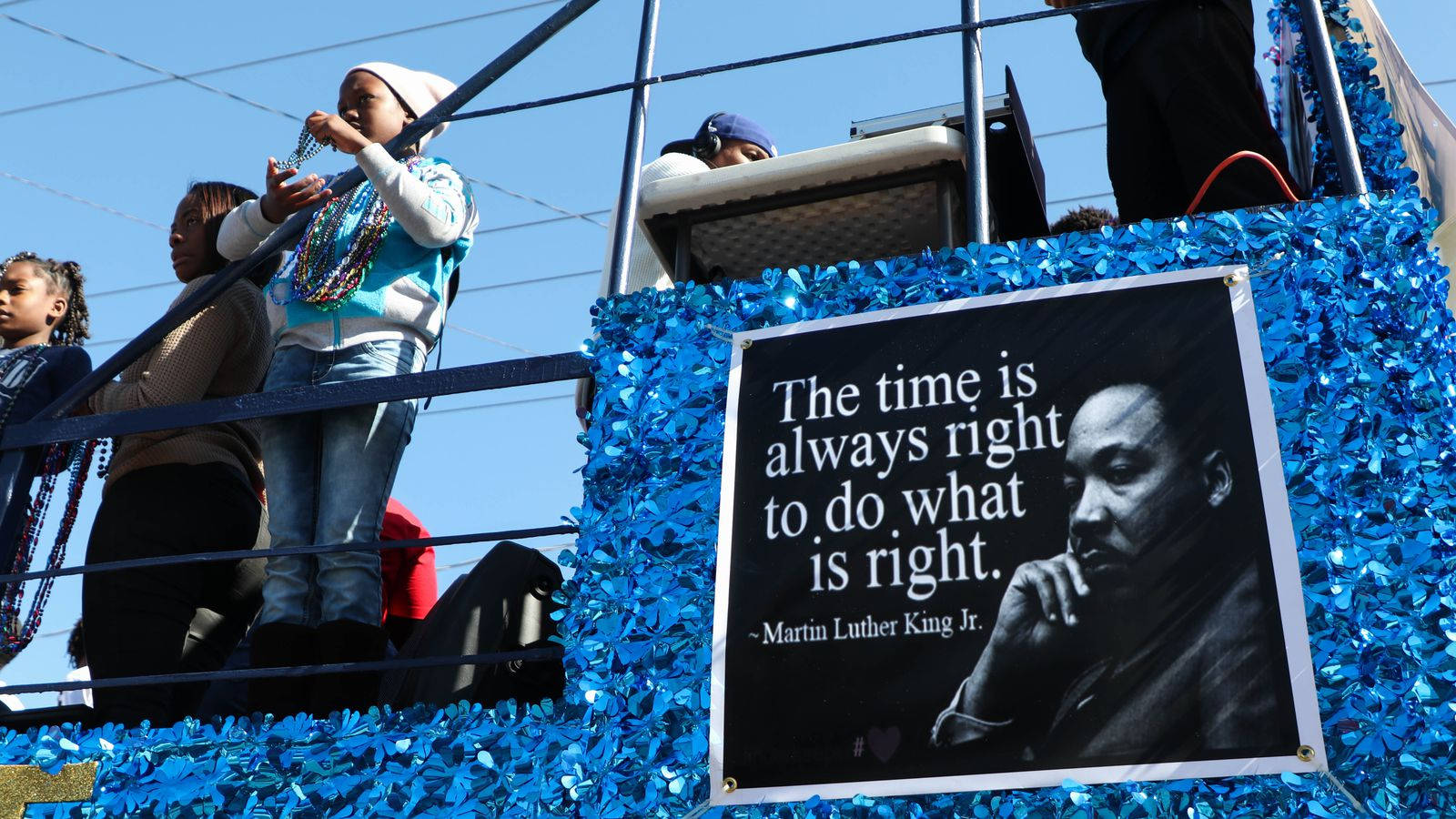 Inspirational Martin Luther King Jr. Poster On Stadium Bleachers Background