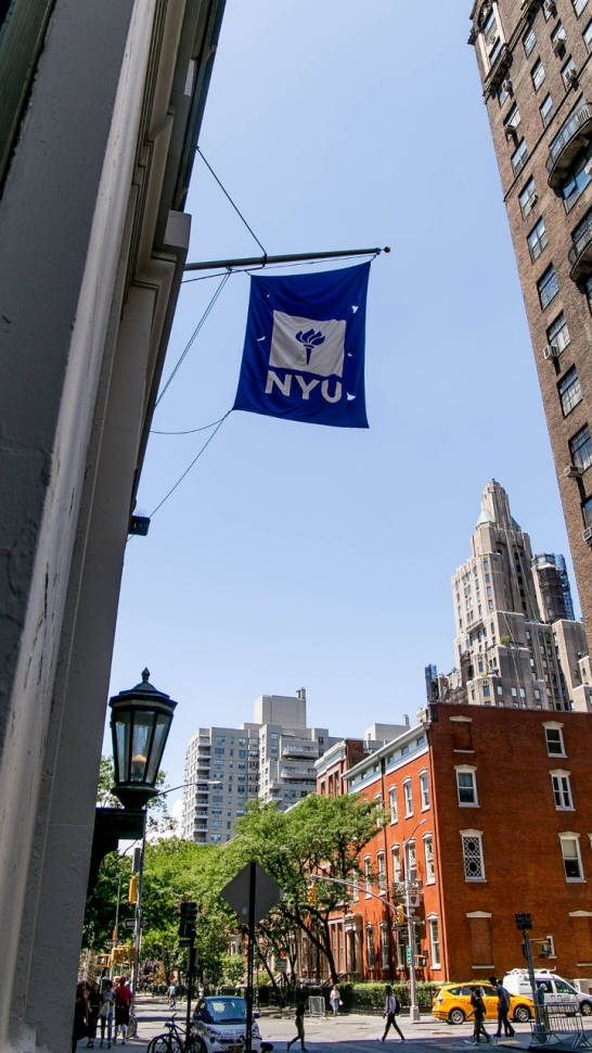 Inspiring View Of Nyu Banner Waving Strongly Background