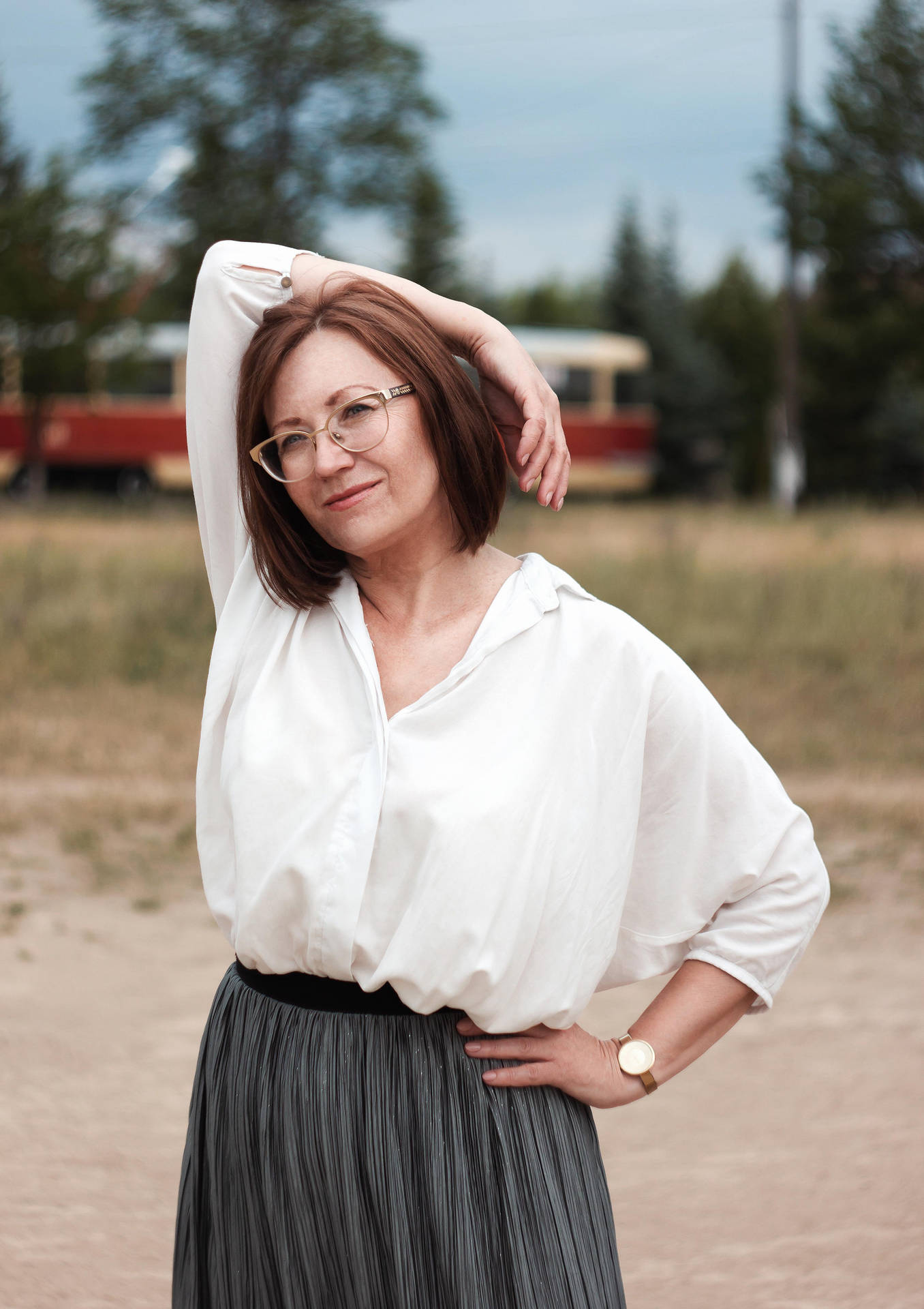 Intellectual Elegance - A Beautiful Mature Woman In Eyeglasses Background