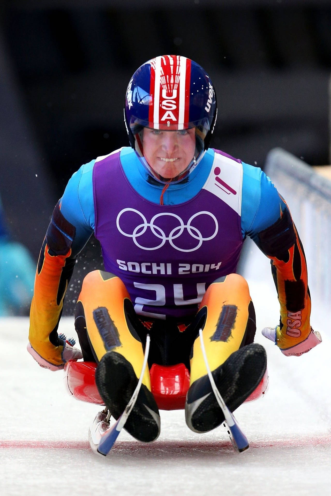 Intense Action Moment Of Tucker West In The Luge Event At Sochi Olympics Background