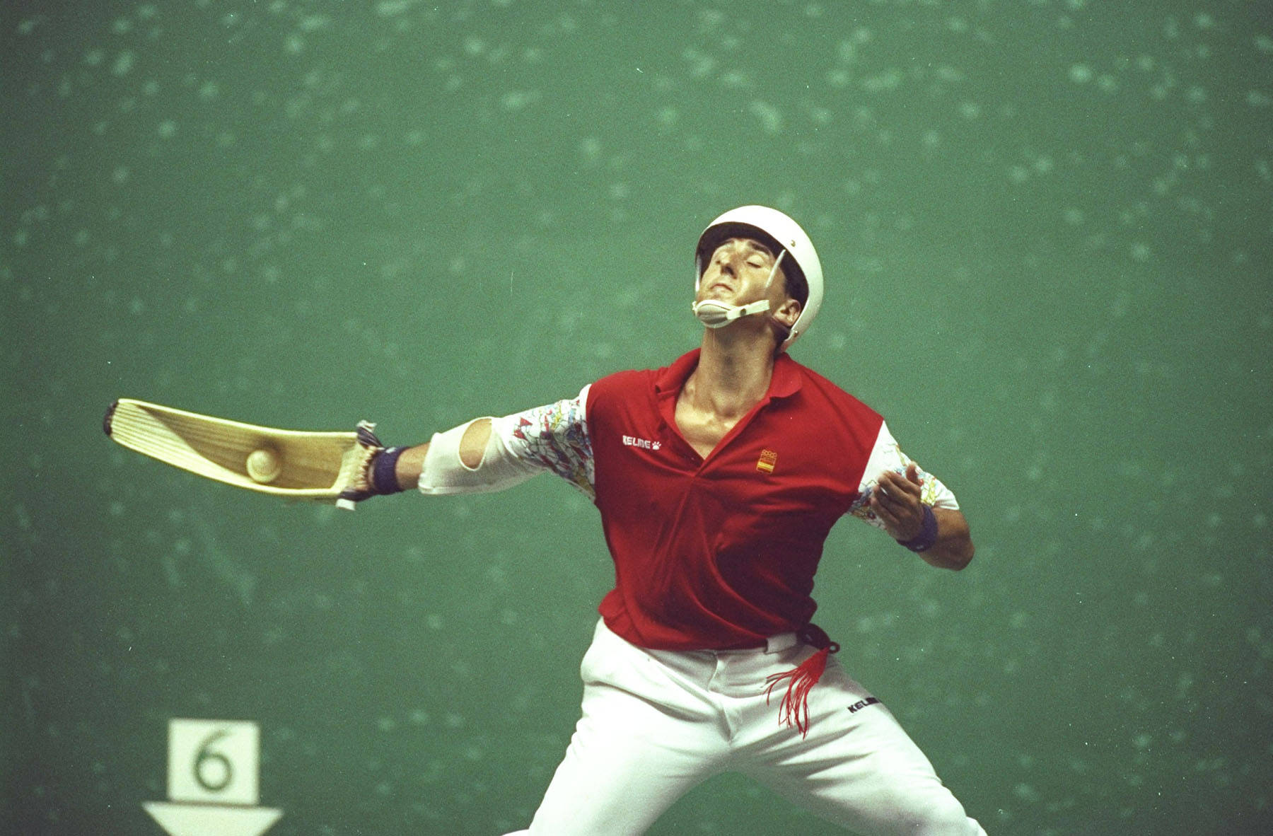 Intense Action Shot Of The Fastest Jai Alai Player Background