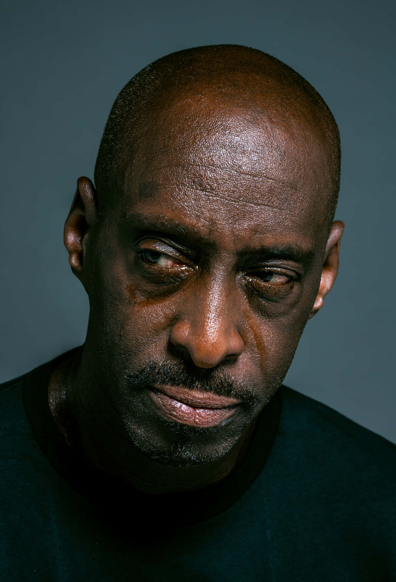 Intense Bald Man Portrait Background