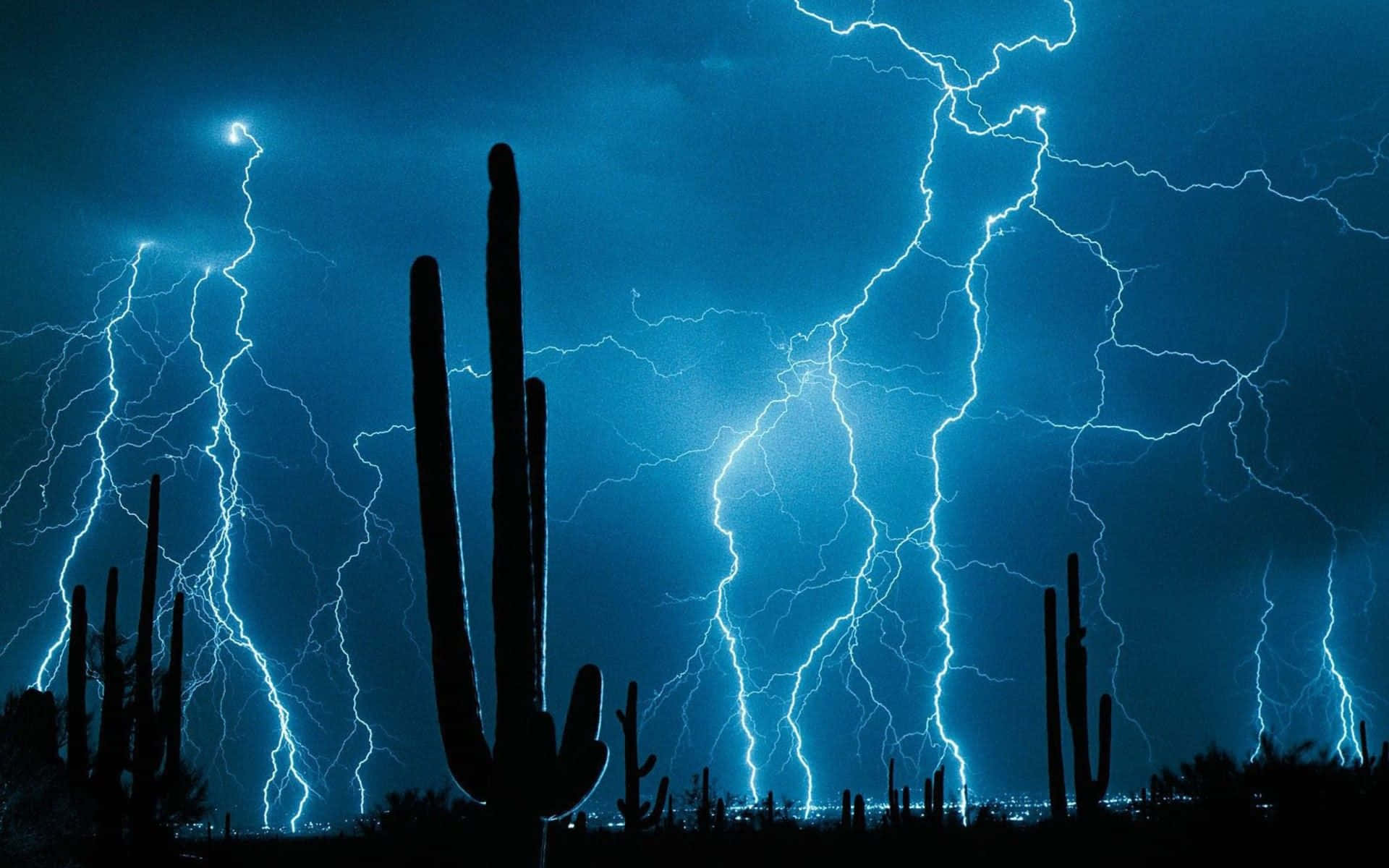 Intense Blue Lightning Unleashing Its Force Background