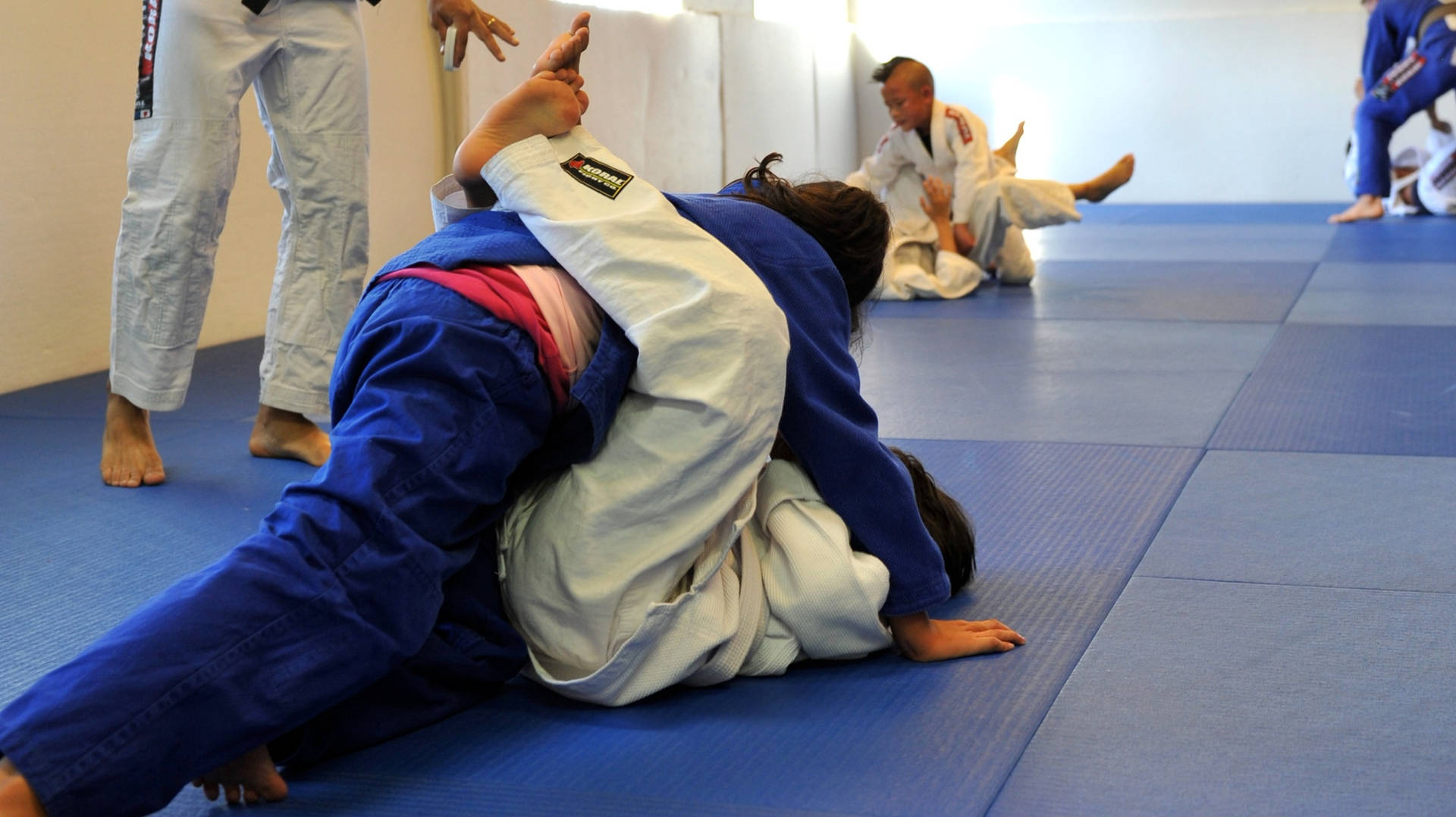 Intense Brazilian Jiu-jitsu Training Session Background