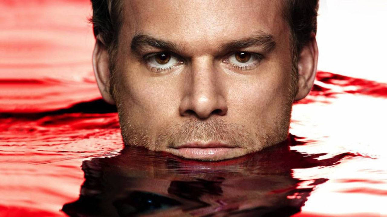 Intense Dexter Morgan Immersed In A Red Pool. Background