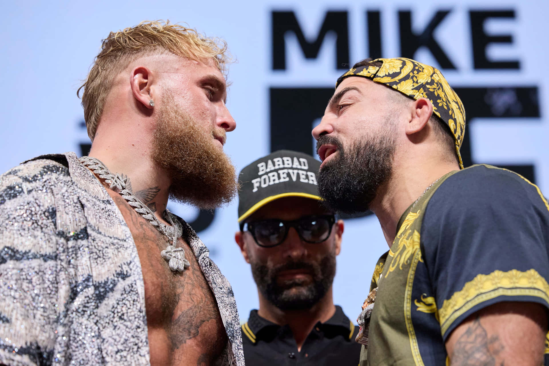 Intense Faceoffat Weigh In Background